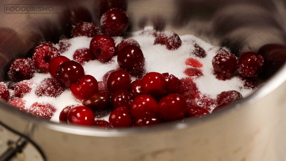 covering the sour cherries with sugar