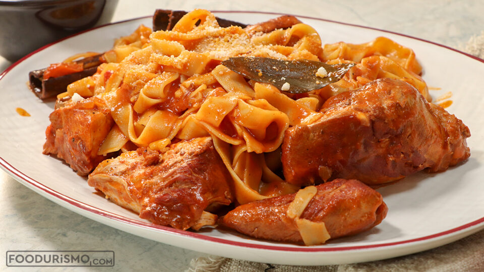 Rooster in tomato sauce with rustic hilopites